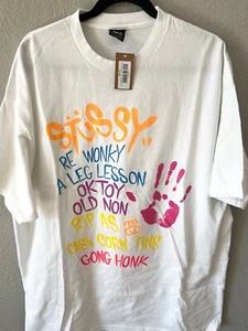 STUSSY X KAWS World Tour XL - Brand New - Picture 1 of 3