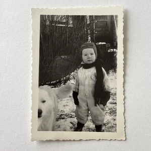 Vintage B&W Snapshot Photograph Adorable Boy In Snowsuit Hat Scarf With Dog - Picture 1 of 7