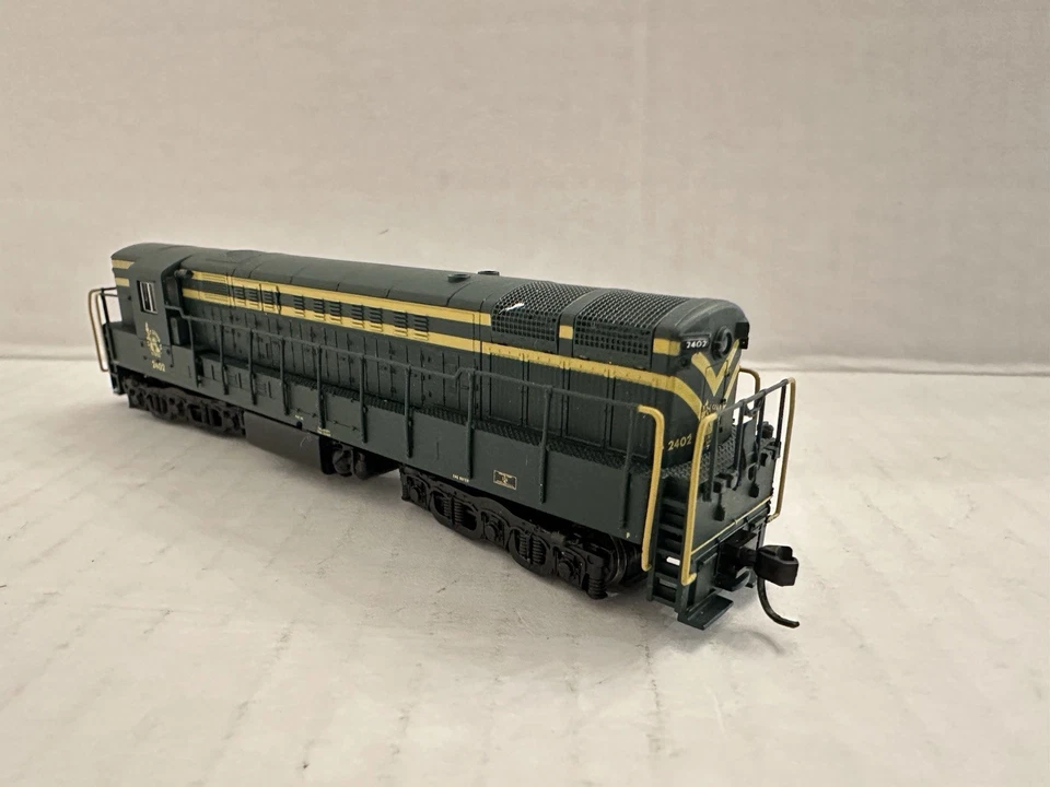 ATLAS  N Scale 49532 Train Master Jersey Central Locomotive #2402 - Image 1 of 4