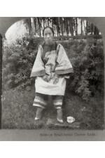 A small-footed Chinese lady,c1905,woman with bound feet,stool,outdoors,photo