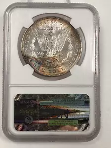 1887P MORGAN DOLLAR / UNIQUE BABY RAINBOW TONING ON REVERSE / NGC MS62 CERTIFIED - Picture 1 of 3