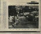 1967 Press Photo Arab refugees walk past tank knocked out by Arar-Israeli clash.