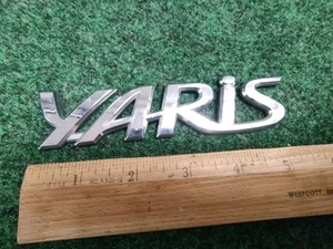 2006-2011 TOYOTA YARIS REAR EMBLEM LOGO BADGE SYMBOL CHROME LETTERS OEM 5S5 - Picture 1 of 5
