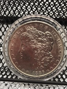 1886 $1 Morgan Silver Dollar - Picture 1 of 4