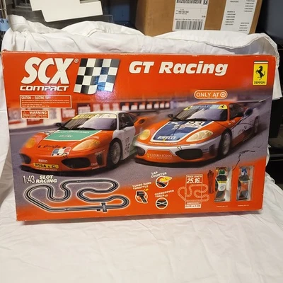 Juego de carreras SCX Compact 2006 1:43 con 3 cajas de pista adicionales y 6 coches de pista Foto 1 de 4