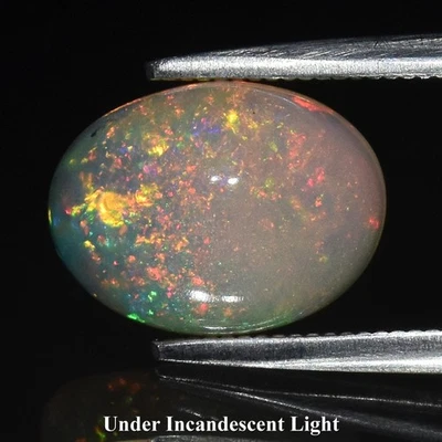 💎 Cabujón ovalado de 1,63 quilates ópalo blanco natural - juego espectral, piedras preciosas de Etiopía Foto 1 de 4