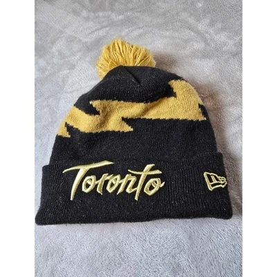 New Era Toronto NBA Baloncesto Negro Dorado Pom Gorro Tejido Gorra Invierno Foto 1 de 4