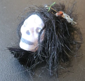 SHRUNKEN HEAD SOUVENIR. JEWELED EYES, SKULL WITH BLACK HAIR. 2 1/2 IN. - Picture 1 of 11