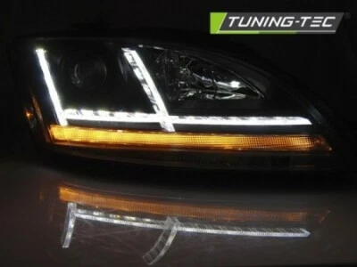 Coppia fari anteriori TUNING DRL TT 2006   2010 neri freccia dinamica ALOGENI H7 - Imagen 1 de 4