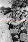 F018439 Woman from Olbersdorf gives flowers to soldiers. Olbersdorf. 1930s. WW2