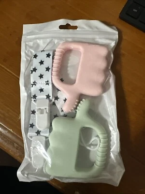 Paquete de 2 juguetes de dentición de silicona Fu Store para bebés pulgares hacia arriba rosa verde Foto 1 de 4