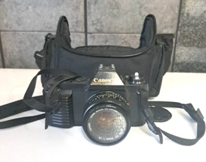 Canon T50 35mm SLR Film Camera w/ Canon FD 50mm 1:1.8 Lens w/Bag WORKS - Picture 1 of 4