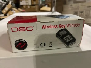 DSC WT4989 4 botones inalámbrico retroiluminado llave de seguridad con pantalla de iconos - Imagen 1 de 1