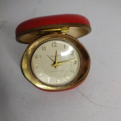 WESTCLOX Red WIND-UP CLAMSHELL TRAVELING ROUND WORLD DIALS ALARM CLOCK Cover