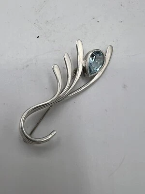 Broche de topacio azul y plata de ley de diseñador Foto 1 de 4