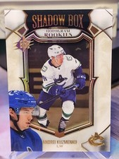 Andrei Kuzmenko 2022-23 SPx #SB-24 Shadow Box Hologram Rookies Gold Spectrum /99