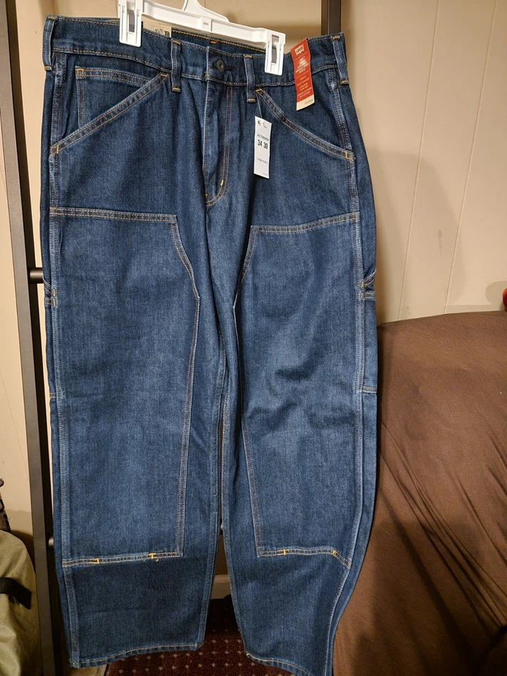 Pantalones de mezclilla para hombre Levis 565 sueltos rectos de doble rodilla talla 34x30 azules con etiquetas Foto 1 de 4