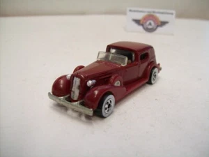 ́35 Classic Caddy, rojo oscuro, Hot Wheels (Hecho en Malasia) 1:64 - Imagen 1 de 3