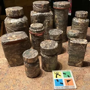 Eleven pre-filled with cool swag and log book, real tree camo taped geocaches - Picture 1 of 11
