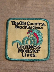 Vintage OLD COUNTRY BUSCH GARDENS LOCHNESS MONSTER LIVES. Gestickter Aufnäher NOS  - Bild 1 von 3