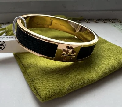 Brazalete Tory Burch 145435 Tory tono dorado/negro pequeño con incrustaciones de cuero talla L  Foto 1 de 4