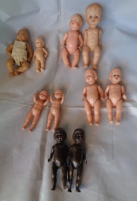 LOTTO 10 BAMBOLE CELLULOIDE NERE VINTAGE DOLL POUPEE DIVISA RARA DIVERSI MARCHI - Immagine 1 di 4