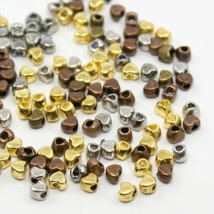 10 Tiny Heart Spacer Beads Assorted Lot Antiqued Bronze Gold Silver 4mm Findings - Picture 1 of 2