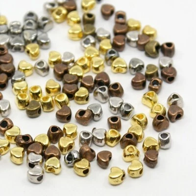 Tiny Heart Spacer Beads Assorted Lot Antiqued Bronze Gold Silver 4mm Findings 50 - Image 1 of 2