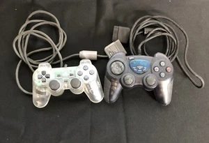 Controlador analógico transparente Sony SCPH-1200 y controlador retro Shock 2 negro PL-600  - Imagen 1 de 7