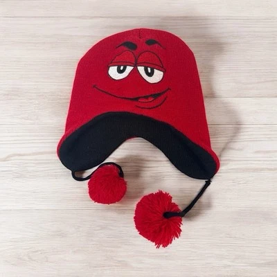 Caramelos de chocolate marca M&M sombrero de lapona cara roja torce borlas invierno nieve Foto 1 de 4