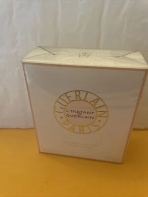 L'INSTANT DE GUERLAIN POR GUERLAIN 1,7 oz/50 ml EAU DE TOILETTE SPRAY NUEVO EN CAJA/ABOLLADURAS Foto 1 de 3