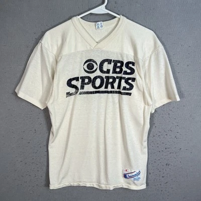 Camiseta deportiva de fútbol americano vintage de los 80 Champion CBS para adulto mediana blanca para hombre Foto 1 de 4