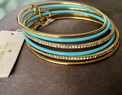 Nuevo con etiquetas Juego de 6 brazaletes pulsera y bolsa antipolvo Kate Spade dorado y azul esmalte y cristal Foto 1 de 4