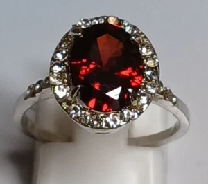 Lab Created Oval Garnet Halo Ring w/Pave Clear CZ Stones in Silver Tone Setting - Picture 1 of 6