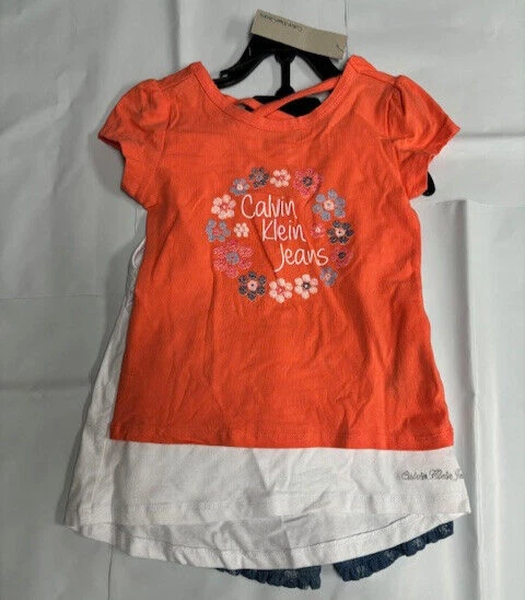 JUEGO DE 3 BLUSAS CALVIN KLEIN NIÑAS SHORTS/2 (NARANJA/BLANCO/AZUL 4T) NUEVO CON ETIQUETAS Foto 1 de 4