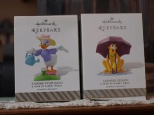 2 Hallmark Ornaments A Year of Disney Magic Pluto Shower Season & Daisy NIB! - Picture 1 of 3