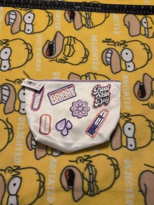 Bolsa de cosméticos de viaje Clinique blanca gráfica Foto 1 de 4