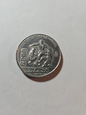 MEXICAN METALIC COIN $200 PESOS YEAR 1986 COPA MUNDIAL DE FUTBOL MEXICO 86 - Image 1 of 3