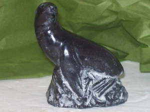 HAND CARVED BLACK RESIN SEAL SITTING ON ROCK FIGURINE - Picture 1 of 5