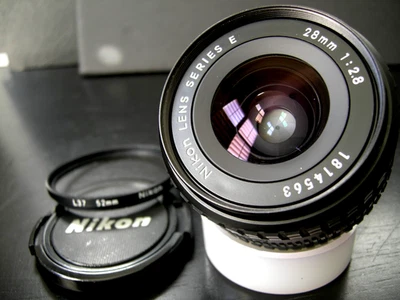 Lente gran angular NIKON 28 mm f/2,8 serie E AIS con filtro L37 F FE FM FA FG EM Foto 1 de 4