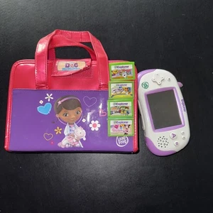 LeapFrog Leapster Explorer Bundle Purple Console,4 Games,& Doc Mcstuffins Case - Picture 1 of 3