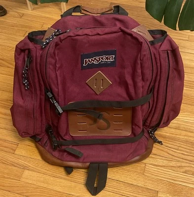 Mochila de día vintage años 90 JanSport con fondo de cuero hecha en EE. UU. granate Foto 1 de 4