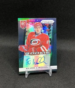 2013-14 Prizm Elias Lindholm AUTO /25 BLACK PRIZM SSP Rookie Card No. 331 ๐๐ - Picture 1 of 20