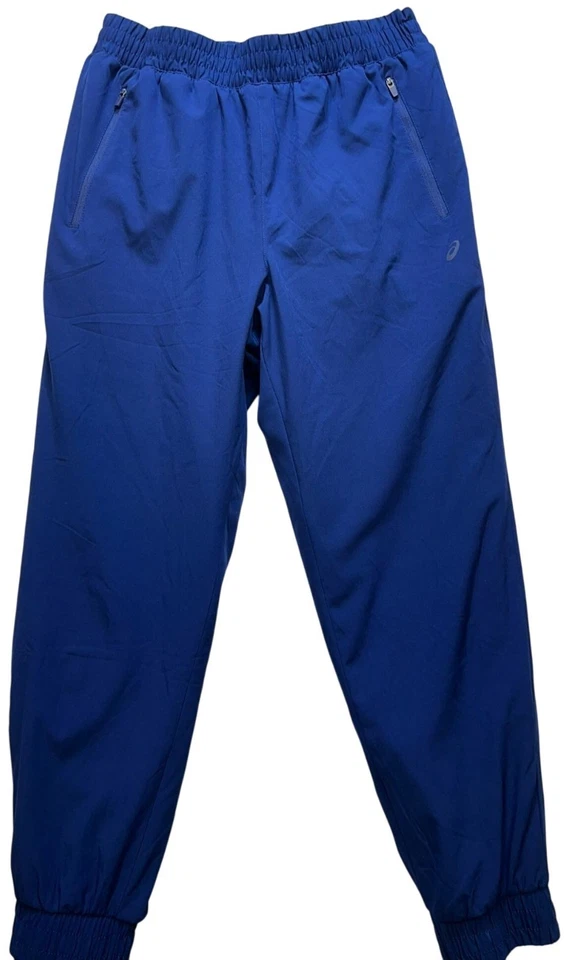 Pantalones de chándal para hombre Asics forrados de lana talla mediana azul bolsillos con cremallera al aire libre Foto 1 de 4