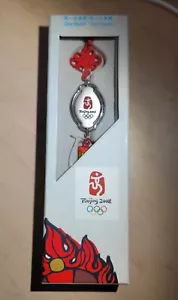 BEIJING 2008 OLYMPICS TASSEL RED NEW ONE WORLD ONE DREAM FRIENDLIES - Picture 1 of 2