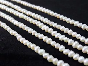 Perline perla d'acqua dolce naturale bianco avorio taglia scelta patate rotonde A+ - Foto 1 di 4