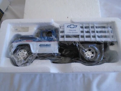 ERTL COLLECTIBLES PRESTIGE SERIES  1957 CHEVY STAKE TRUCK GENERAL MOTORS  - Image 1 of 4