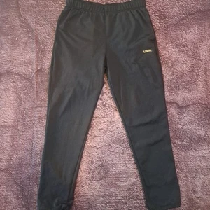 Pantalones deportivos UNRL Performance grandes negros para hombre - Imagen 1 de 5