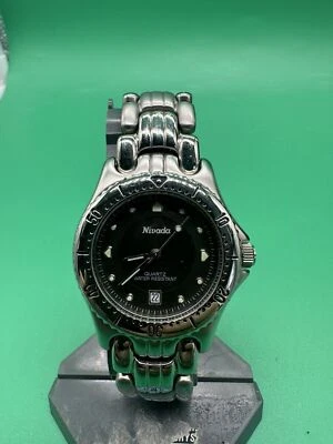 Reloj suizo NIVADA para hombre con correa de acero inoxidable con fecha funciona perfecto Foto 1 de 4