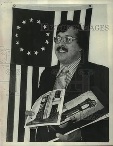1975 Press Photo Carl Misner displays photos of bicentennial clock, Colonie, NY - Picture 1 of 2